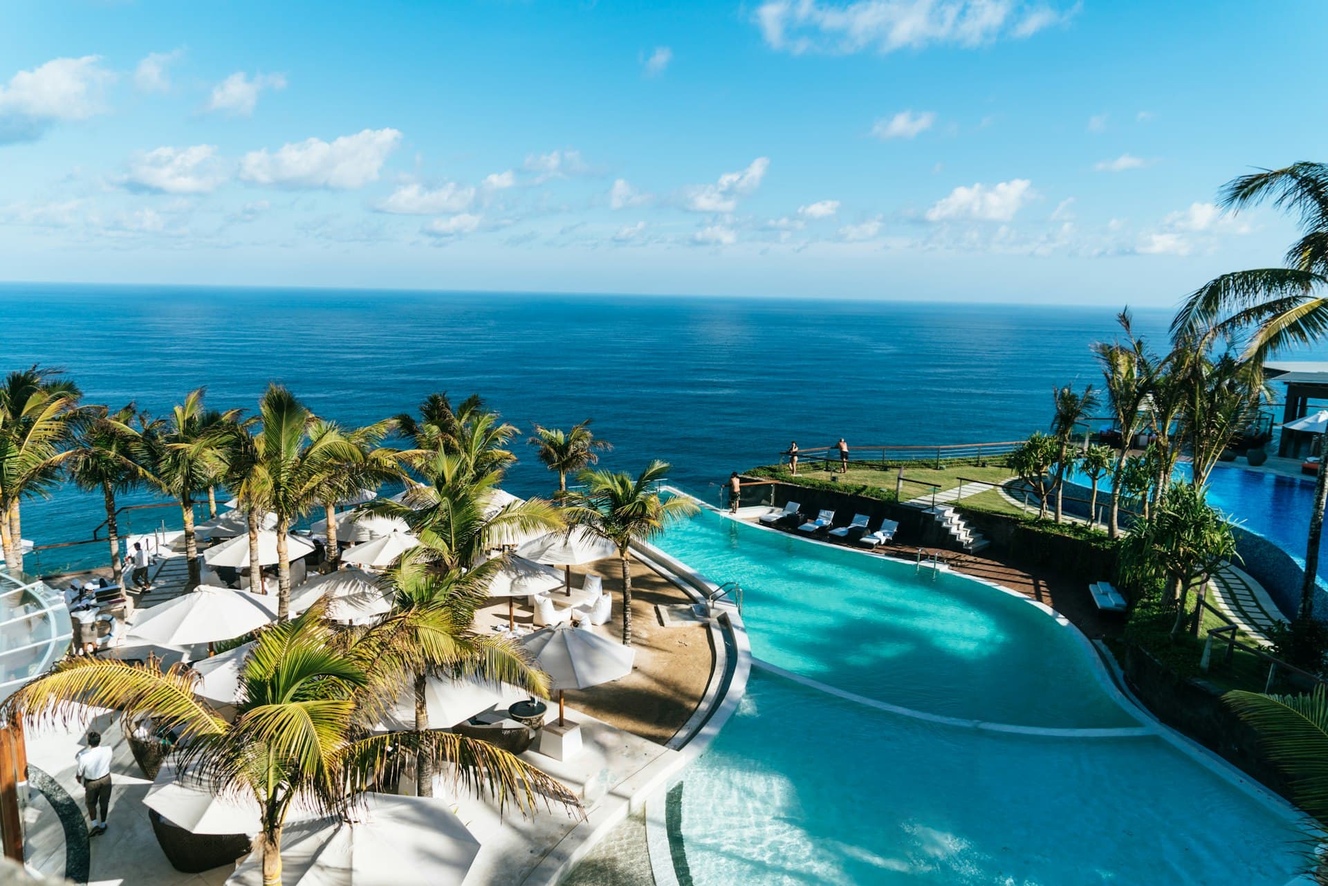 Cliffside infinity pool overlooking the ocean at golden hour